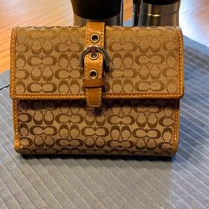 Classic Coach wallet with cream lined interior
